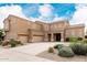 Expansive home featuring a large three car garage, desert landscaping, and covered front entryway at 3317 W Knudsen Dr, Phoenix, AZ 85027