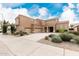 Expansive home featuring a large three car garage, desert landscaping, and covered front entryway at 3317 W Knudsen Dr, Phoenix, AZ 85027