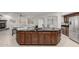 Gourmet kitchen island featuring dark wood cabinetry and a granite countertop with seating at 3317 W Knudsen Dr, Phoenix, AZ 85027