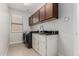 Practical laundry room with cabinets, countertops, and washer-dryer at 3317 W Knudsen Dr, Phoenix, AZ 85027