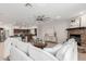 Cozy living room featuring a stone fireplace and view into the open-concept kitchen at 3317 W Knudsen Dr, Phoenix, AZ 85027