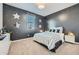 Starry themed bedroom with striped bedding and carpet flooring at 3399 E Open Prairie Dr, San Tan Valley, AZ 85140