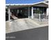 Exterior view of a well-kept single-Gathering home featuring a covered carport at 3504 N Hawes Rd # 3504, Mesa, AZ 85207