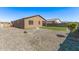 This home's backyard includes a stone perimeter and rock landscaping at 3903 E French Trotter St, San Tan Valley, AZ 85140