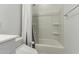 Bathroom featuring a shower-tub combination with white ceramic tile and a white shower curtain at 3903 E French Trotter St, San Tan Valley, AZ 85140