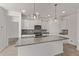 Kitchen with large island, granite countertops, stainless steel appliances, and white cabinetry at 3903 E French Trotter St, San Tan Valley, AZ 85140