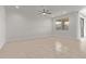 Bright and airy living room with tile flooring and a ceiling fan at 3903 E French Trotter St, San Tan Valley, AZ 85140