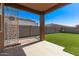 Covered patio space with view of the green backyard and privacy fence at 3903 E French Trotter St, San Tan Valley, AZ 85140