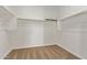 Walk-in closet featuring carpeted floors, white walls, and white shelving with metal rods for hanging clothes at 3903 E French Trotter St, San Tan Valley, AZ 85140