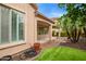 Exterior view of covered patio featuring a view of the beautiful, landscaped backyard at 4121 E Narrowleaf Dr, Gilbert, AZ 85298