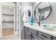 Elegant bathroom vanity featuring decorative mirrors, sleek gray cabinets, and stylish fixtures at 4121 E Narrowleaf Dr, Gilbert, AZ 85298