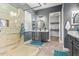 Modern bathroom featuring a glass shower, dual sinks, and stylish fixtures and finishes at 4121 E Narrowleaf Dr, Gilbert, AZ 85298