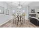 Cozy dining area features decorative furniture, unique lighting, and charming decor against neutral walls at 4121 E Narrowleaf Dr, Gilbert, AZ 85298