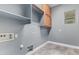 Functional laundry room with built-in shelving and storage solutions, simplifying household tasks at 4121 E Narrowleaf Dr, Gilbert, AZ 85298