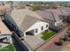 Aerial view of home showing fenced yard with pavers, artificial grass, and proximity to neighboring houses at 4135 E Cathy Dr, Gilbert, AZ 85296