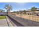 Fenced backyard offers privacy and security, complemented by gravel accents along the concrete block fence line at 4135 E Cathy Dr, Gilbert, AZ 85296