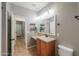 Bathroom features a vanity, toilet, decorative shelves, and neutral color scheme at 4135 E Cathy Dr, Gilbert, AZ 85296