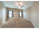 Bedroom with carpet flooring, ceiling fan, neutral paint color, and natural light at 4135 E Cathy Dr, Gilbert, AZ 85296