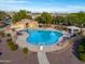 Aerial view of community pool and amenity center with lounge chairs and mountain views at 4135 E Cathy Dr, Gilbert, AZ 85296