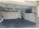 Spacious garage with ample storage, water heater, water softener, and epoxy flooring ready for your vehicles and projects at 4135 E Cathy Dr, Gilbert, AZ 85296