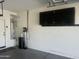 A well-equipped garage showcasing the water heater, water filtration system, and overhead storage cabinets at 4135 E Cathy Dr, Gilbert, AZ 85296