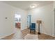 Hallway includes a blue chair and access to the bathroom with a vanity at 4135 E Cathy Dr, Gilbert, AZ 85296