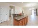 Kitchen island featuring granite countertops with seating overlooking the dining area at 4135 E Cathy Dr, Gilbert, AZ 85296