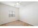 Neutral bedroom with carpet, a ceiling fan, one window, and electrical outlets at 44087 W Granite Dr, Maricopa, AZ 85139