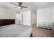 Neutral Primary bedroom with ample space, a ceiling fan, and two dressers at 44961 W Miraflores St, Maricopa, AZ 85139