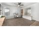 Bright room with two windows, neutral carpet, built-in bench seating, and ample space at 44961 W Miraflores St, Maricopa, AZ 85139