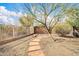 Desert landscaping in backyard with stone path along the fence line, enhancing the property's outdoor appeal at 4533 E Coyote Wash Dr, Cave Creek, AZ 85331