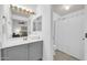 Bathroom with a wide mirror, grey vanity and shower with a curtain at 4533 E Coyote Wash Dr, Cave Creek, AZ 85331