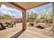 Relaxing covered patio with charming desert landscaping, a perfect outdoor retreat for enjoying peaceful moments at 4533 E Coyote Wash Dr, Cave Creek, AZ 85331