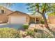 Charming single-story home with a desert-landscaped front yard and two-car garage at 4533 E Coyote Wash Dr, Cave Creek, AZ 85331