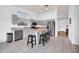 A well-lit kitchen with stainless steel appliances, grey cabinets, and a butcher block island at 4533 E Coyote Wash Dr, Cave Creek, AZ 85331