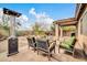 Inviting backyard patio with comfortable seating and heater, ideal for relaxing or entertaining in a desert landscaped yard at 4533 E Coyote Wash Dr, Cave Creek, AZ 85331