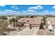 Aerial view of a single-story home with tile roof, mature trees, and landscaped front yard at 4618 E Carriage Ct, Gilbert, AZ 85297