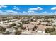 An aerial view of cozy homes with desert landscaping, nestled within a quiet and inviting residential community at 4618 E Carriage Ct, Gilbert, AZ 85297