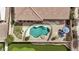 An aerial view shows the pool, patio, fire pit and putting green at 4618 E Carriage Ct, Gilbert, AZ 85297