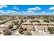 Residential community with cozy homes featuring tile roofs, desert landscaping, and sidewalks, showcasing a welcoming neighborhood at 4618 E Carriage Ct, Gilbert, AZ 85297