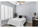 Well-lit bedroom features neutral walls, plantation shutters, and cozy carpeting at 4618 E Carriage Ct, Gilbert, AZ 85297