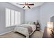 Serene bedroom showcases plantation shutters, neutral walls, and a comfortable setting at 4618 E Carriage Ct, Gilbert, AZ 85297