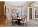 Cozy dining room with seating for six features shuttered windows and a stylish chandelier at 4618 E Carriage Ct, Gilbert, AZ 85297