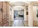 Open foyer with tile flooring and arched openings into the living spaces of the home at 4618 E Carriage Ct, Gilbert, AZ 85297