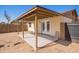 Covered backyard patio extends from the home, perfect for relaxing at 5115 W Surrey Ave, Glendale, AZ 85304