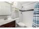 Bathroom featuring updated subway tile, dark fixtures, and a classic vanity at 5115 W Surrey Ave, Glendale, AZ 85304