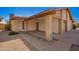 View of a covered car port featuring a brick support beam at 5115 W Surrey Ave, Glendale, AZ 85304