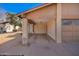 View of a home with a covered car port and desert landscaping in the front at 5115 W Surrey Ave, Glendale, AZ 85304