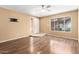 Bright living room featuring modern flooring and a large window at 5115 W Surrey Ave, Glendale, AZ 85304