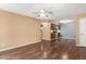 Spacious living room featuring modern flooring and a ceiling fan at 5115 W Surrey Ave, Glendale, AZ 85304